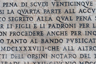 A restored granite tombstone with clear inscriptions and no signs of dirt or lichen.