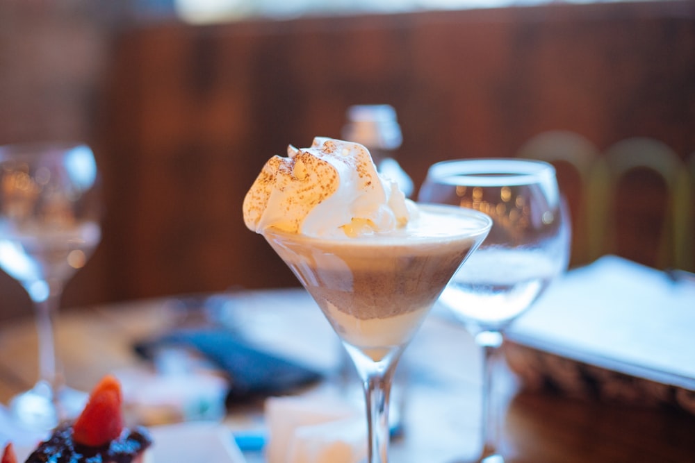 a dessert in a martini glass on a table