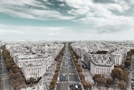 An aerial shot of a bustling city with various transportation options visible.