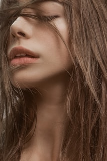 woman with blonde hair and black eyes
