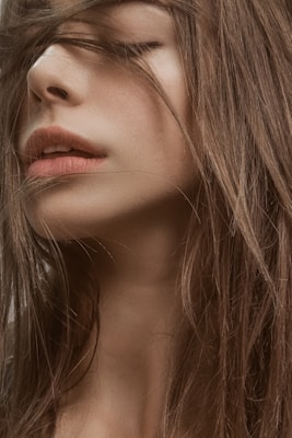 woman with blonde hair and black eyes