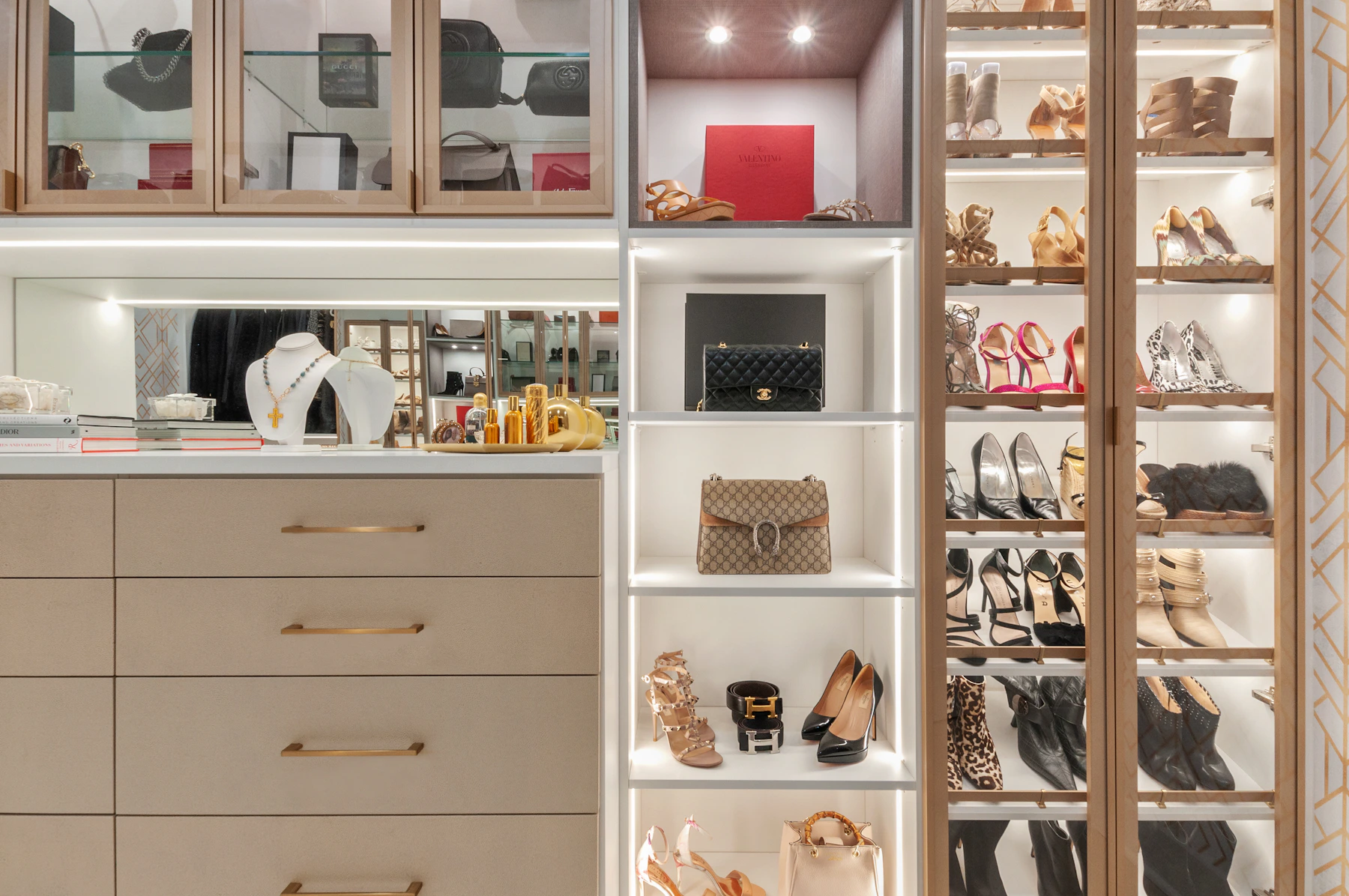 Organized walk-in storage with drawers and neatly arranged shelves