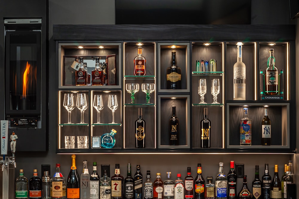 bottles on brown wooden shelf