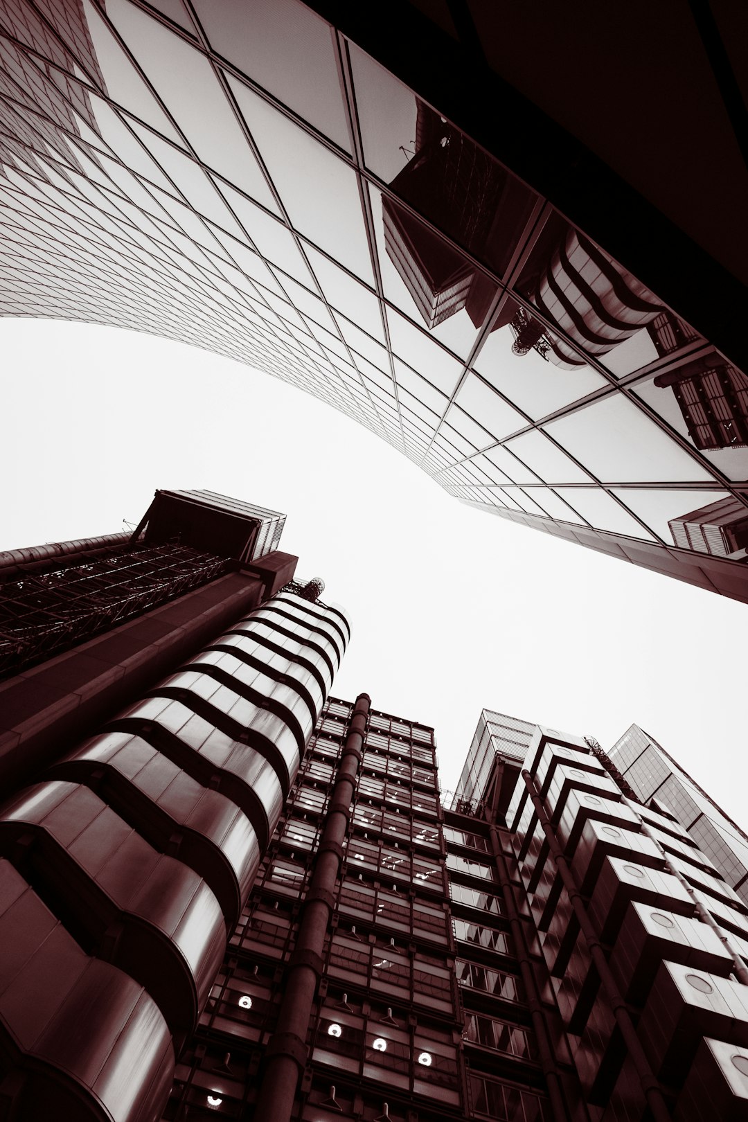 low angle photography of red and white concrete building