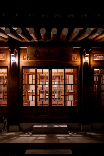 brown wooden door with glass panel