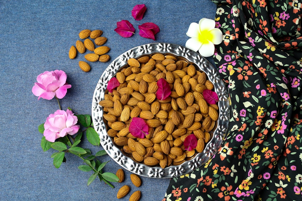 yellow and pink flower petals on blue and white floral ceramic bowl