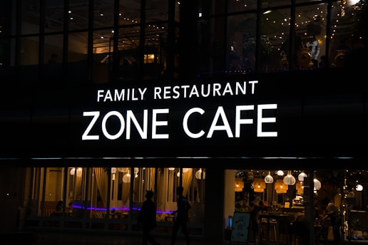 a sign that reads family restaurant zone cafe