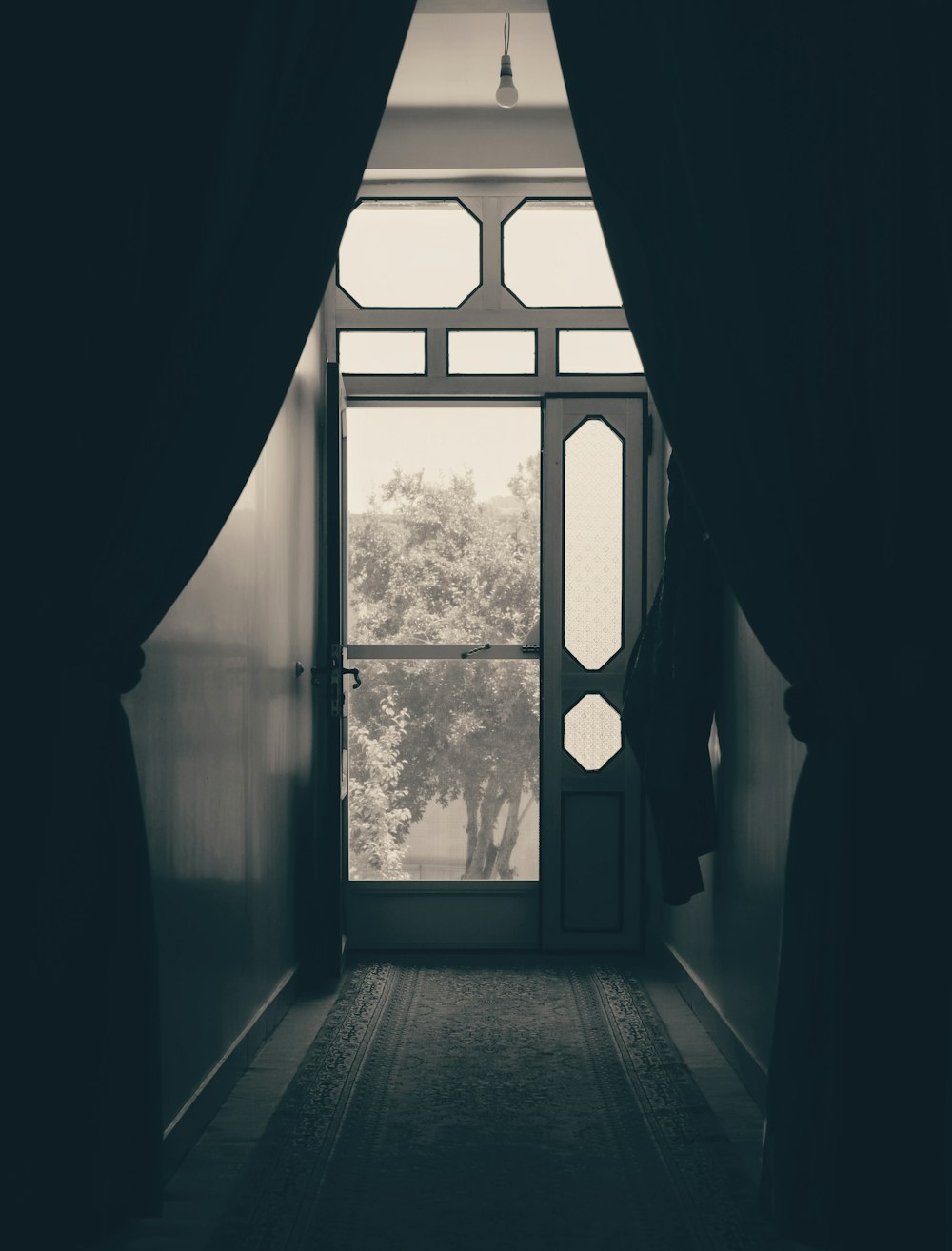 silhouette of window with curtain