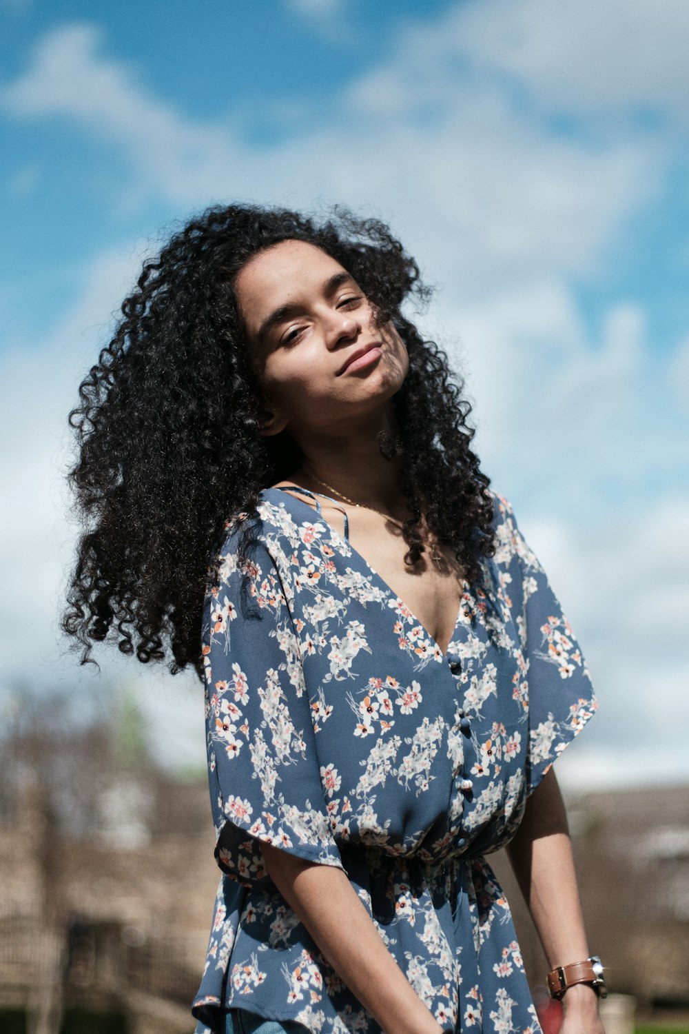 woman in blue and white floral dress