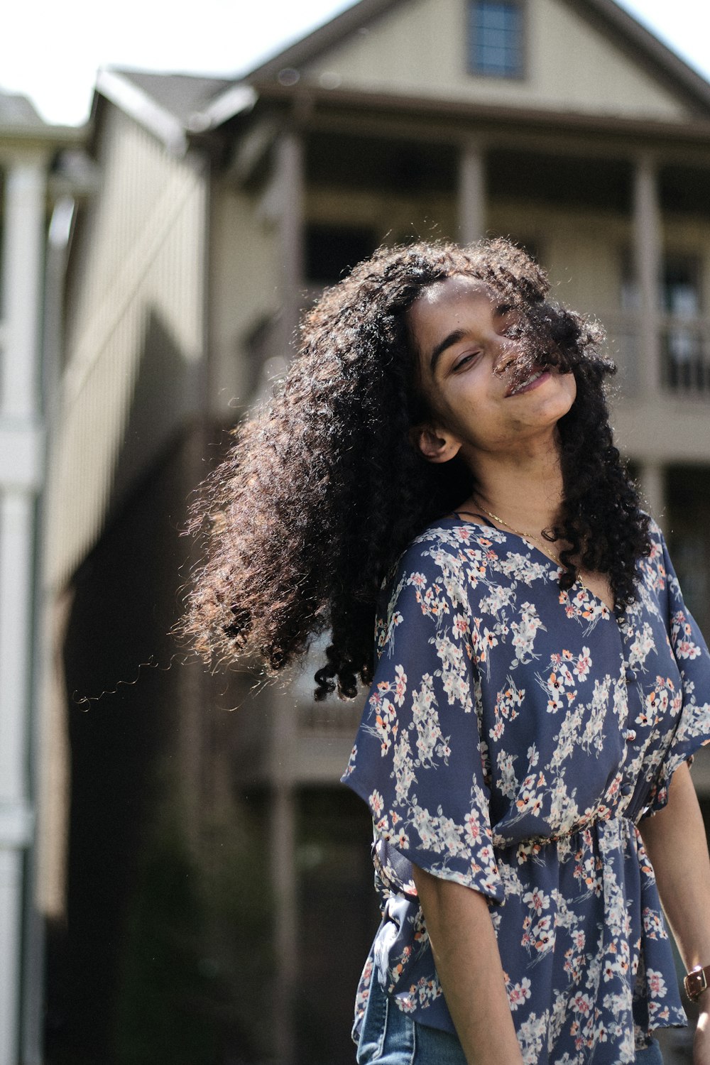 woman in blue and white floral shirt