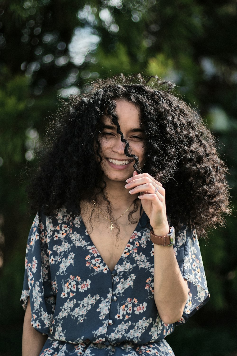 woman in blue and white floral dress