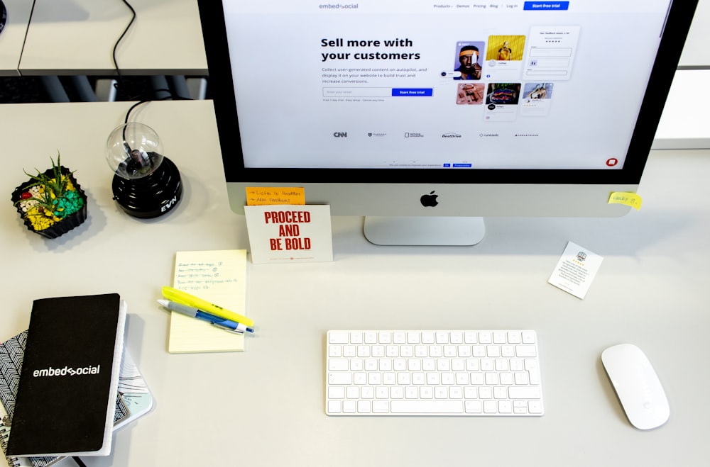 silver imac with apple keyboard and magic mouse