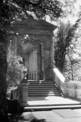 Black and white photo of courthouse steps at dusk.