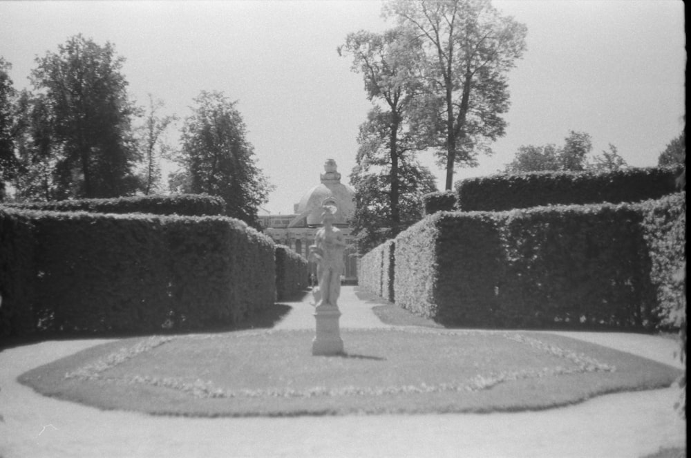 grayscale photo of man statue