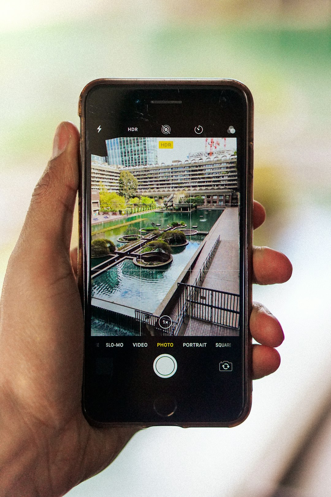 person holding black iphone 4