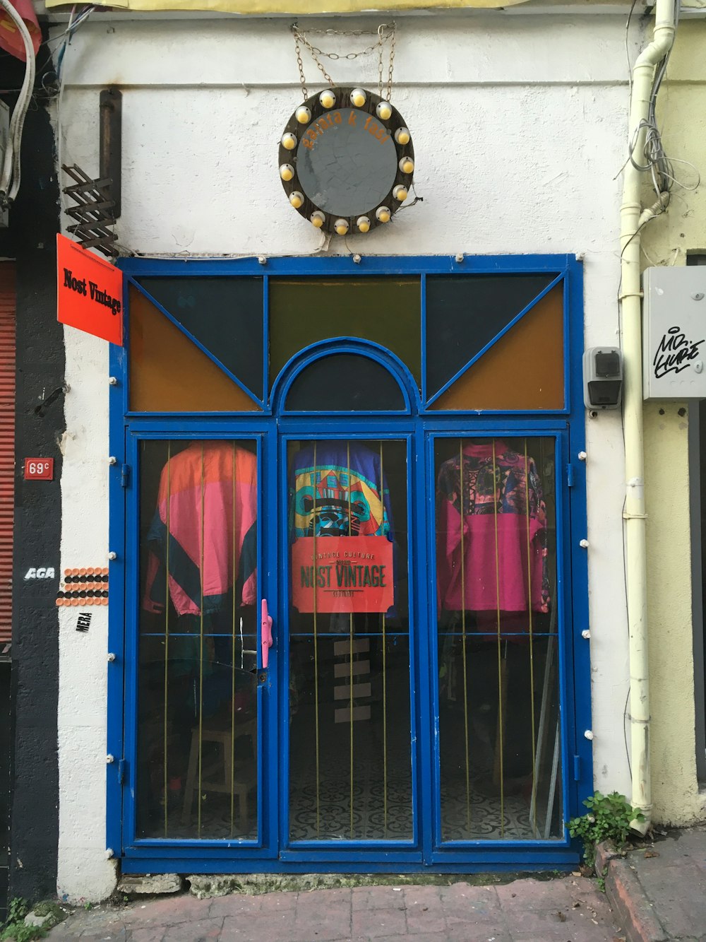 blue wooden door with blue steel door