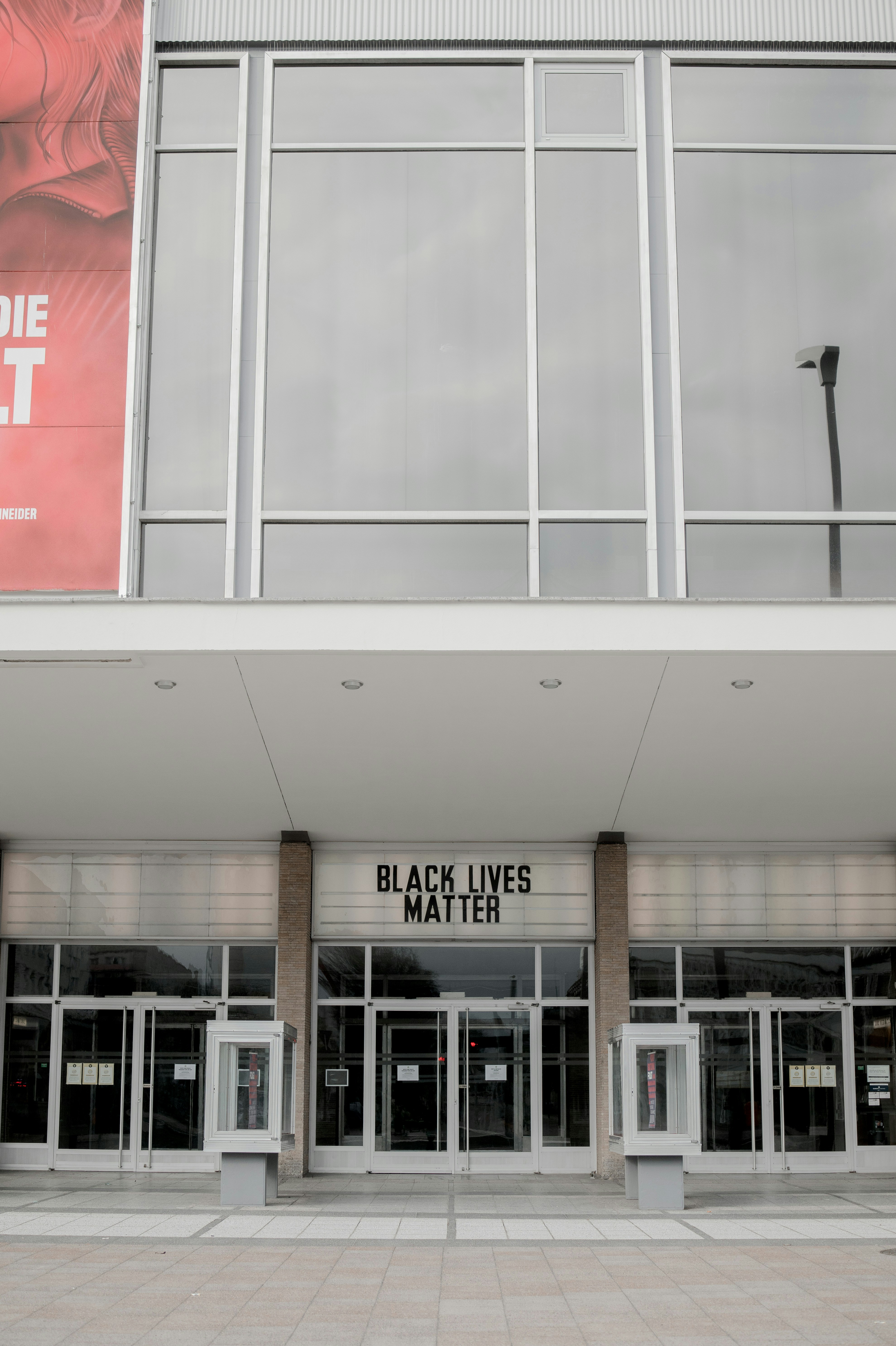 Modern office building exterior with entrance signage