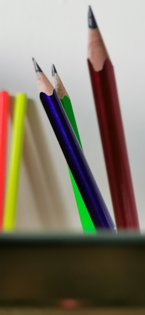 multi colored coloring pencils on white surface