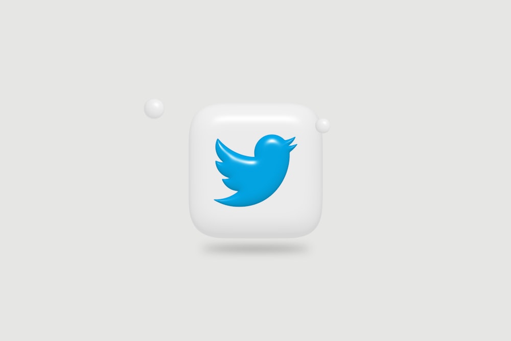 a blue twitter logo on a white square