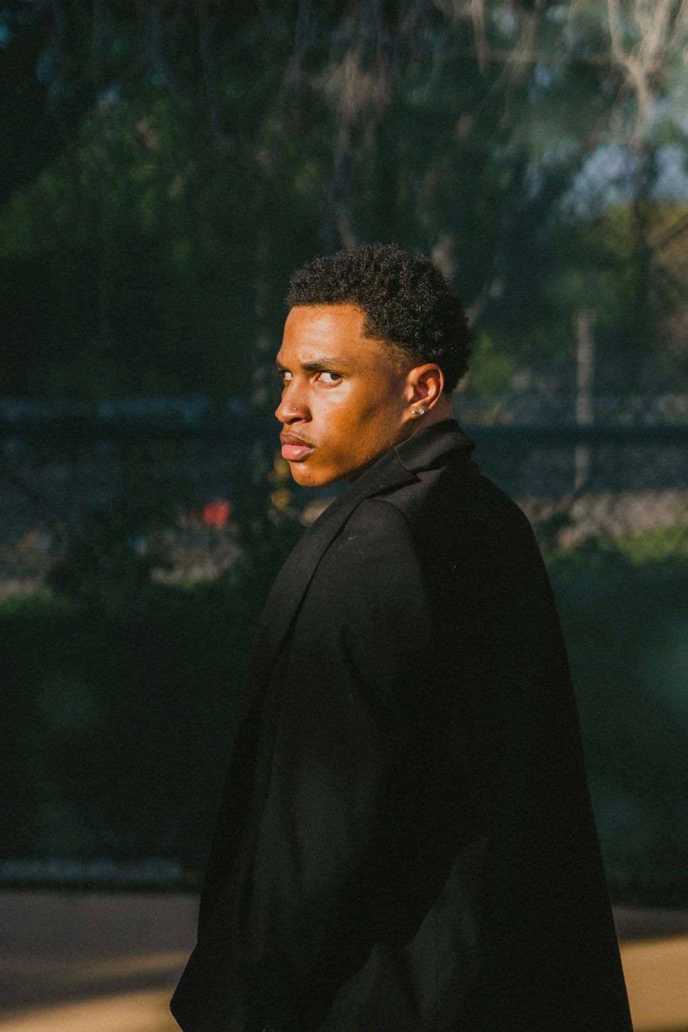 man in black hoodie standing