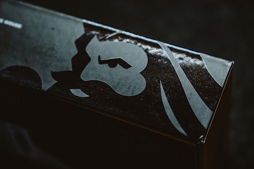 Close-up of a sleek, light packaging box with Puregold Prints logo in Lagos studio.