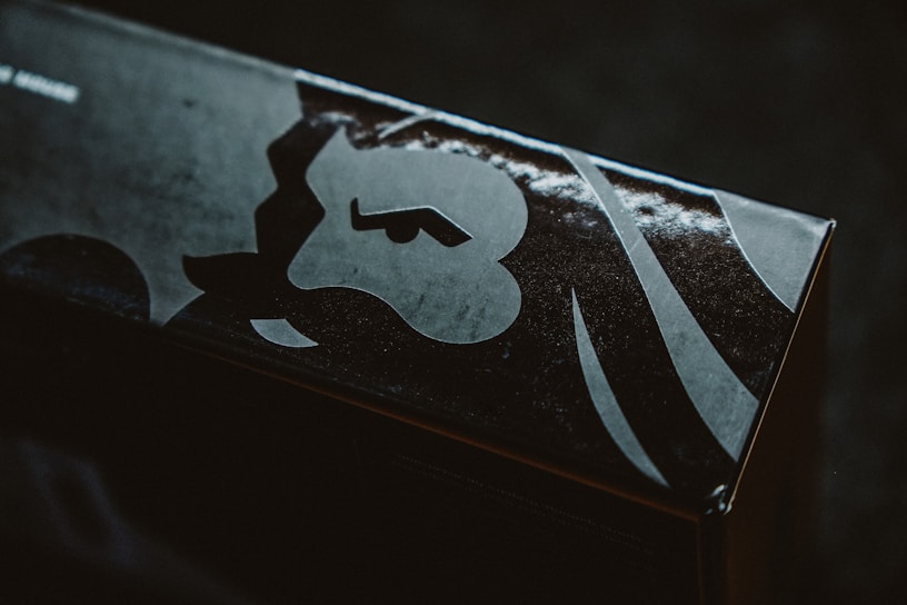 A close-up of a vibrant custom box featuring a bold, eye-catching logo printed with sharp detail.