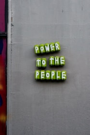 green and yellow happy new year signage