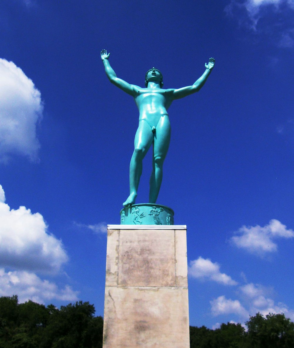 statue of man under blue sky during daytime