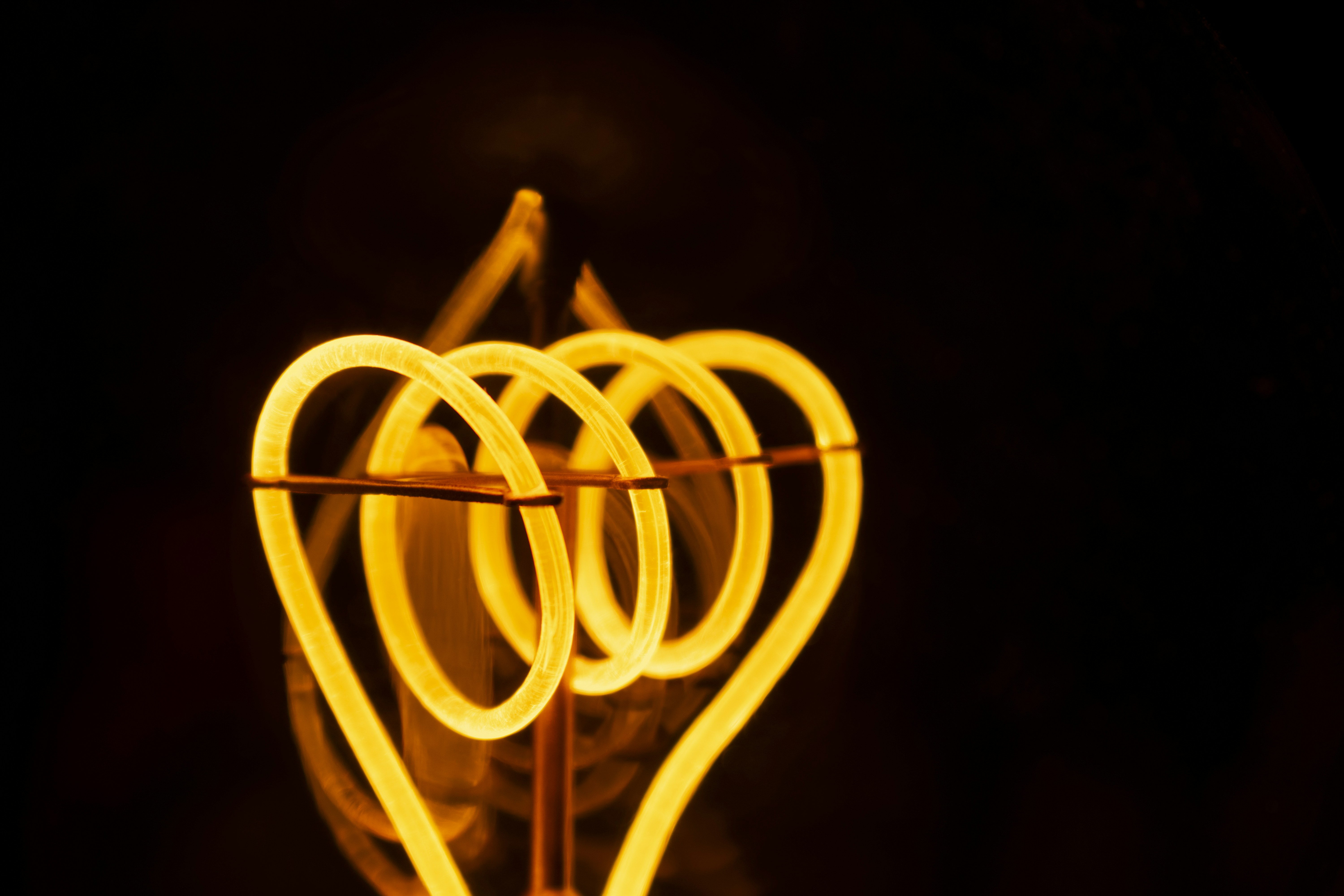 yellow spiral light in dark room