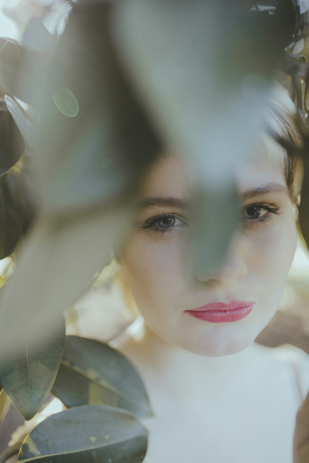 woman in white shirt with red lipstick