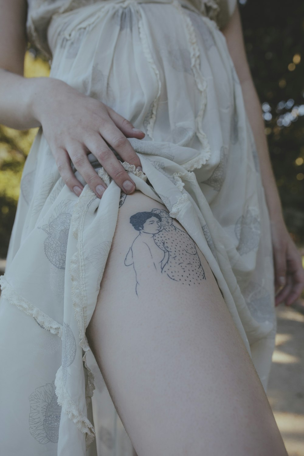 woman with black floral tattoo on her back