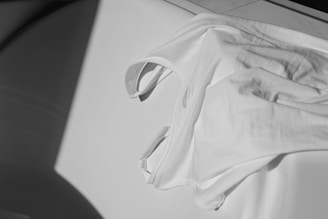white textile on white table