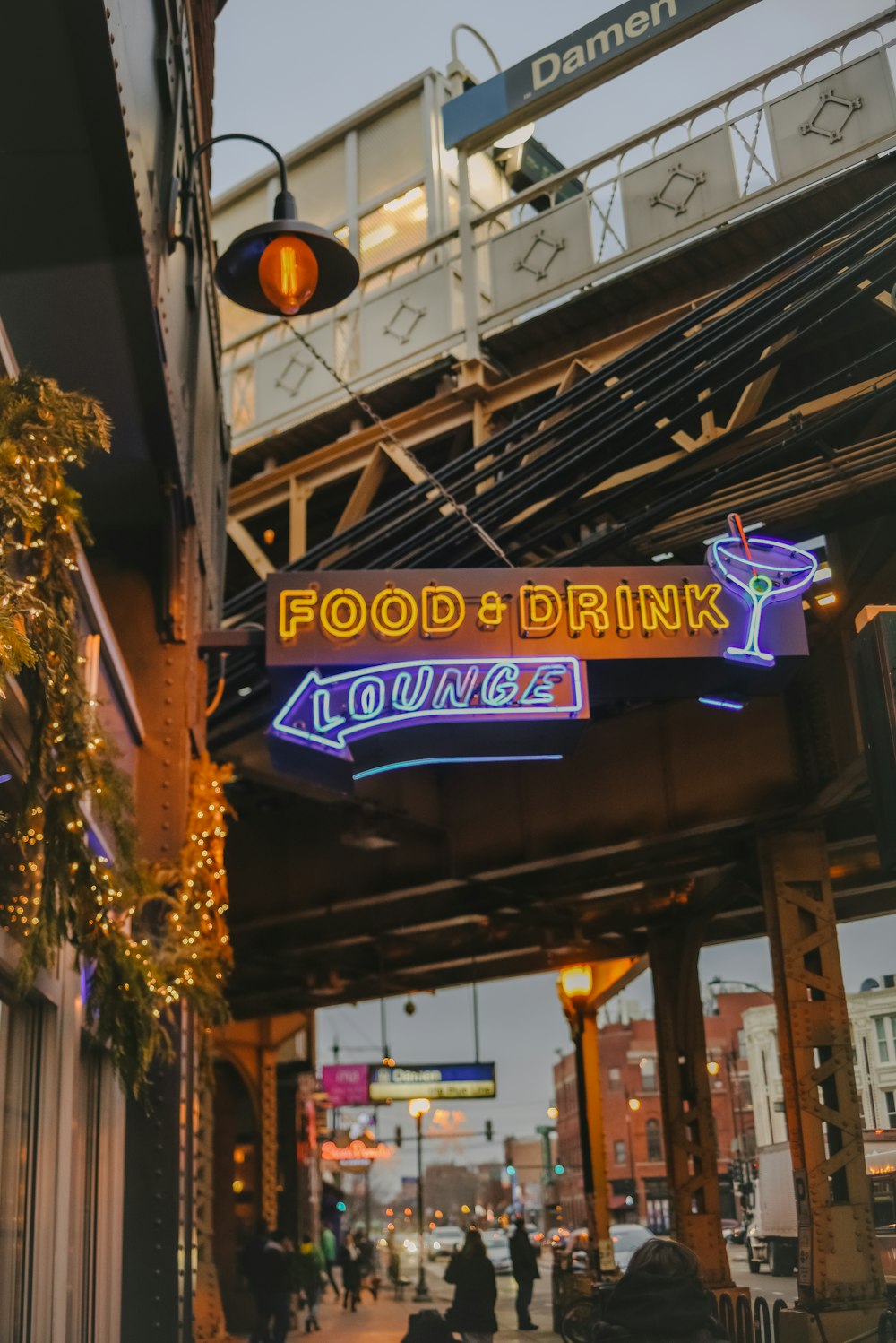 purple and yellow UNKs bar signage