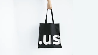 Elegant white tote bag featuring aszait sounds logo in black