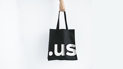 A sturdy black tote bag with the Stud's Bar name printed in white and red.