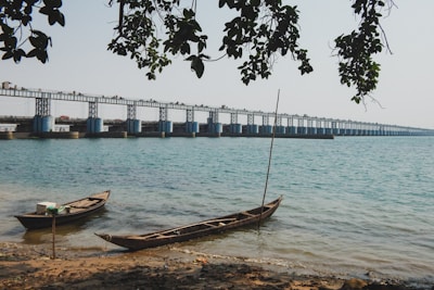 brown boat on shore during daytime
