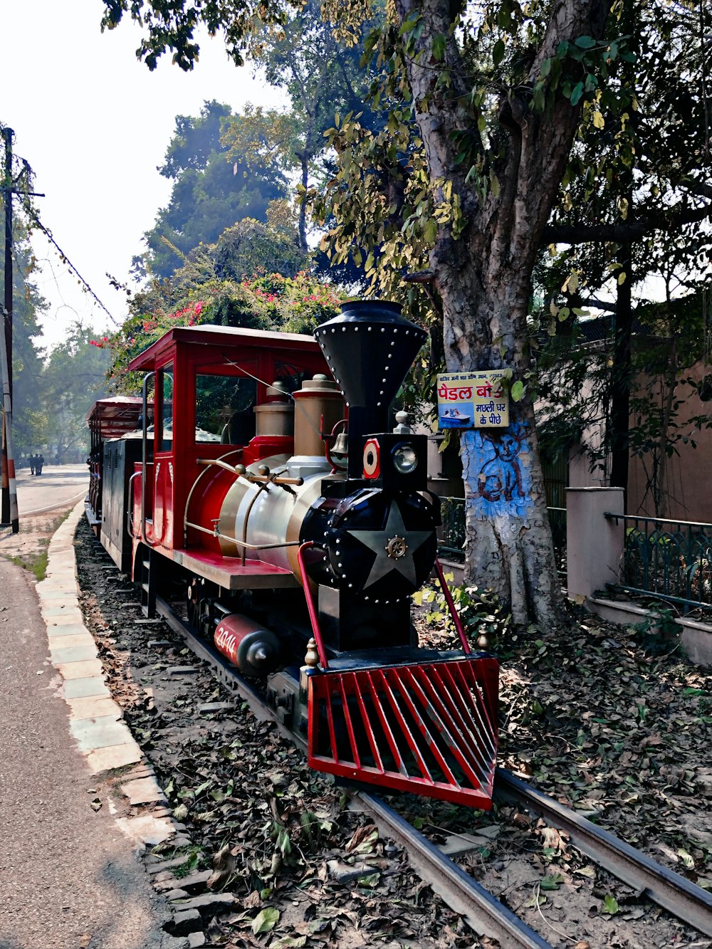 red and black train on rail tracks