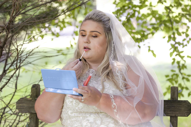 Bride writing in a wedding planning notebook