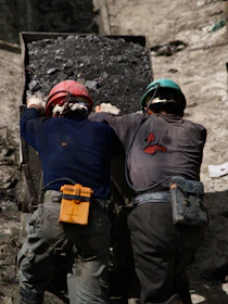 2 men in blue jacket wearing helmet