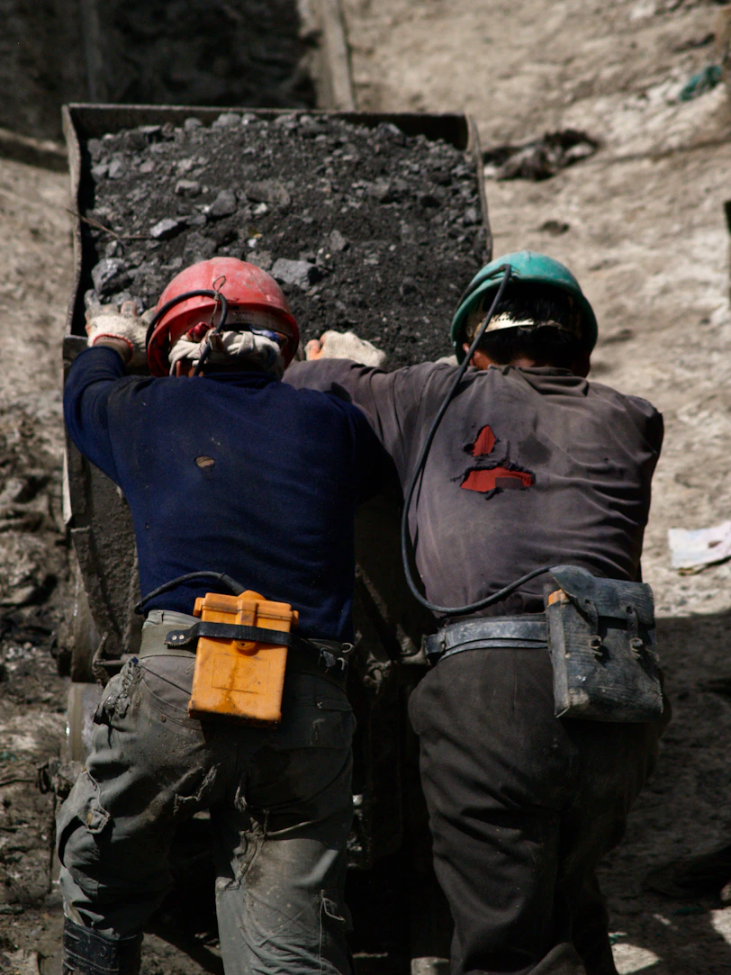 2 men in blue jacket wearing helmet