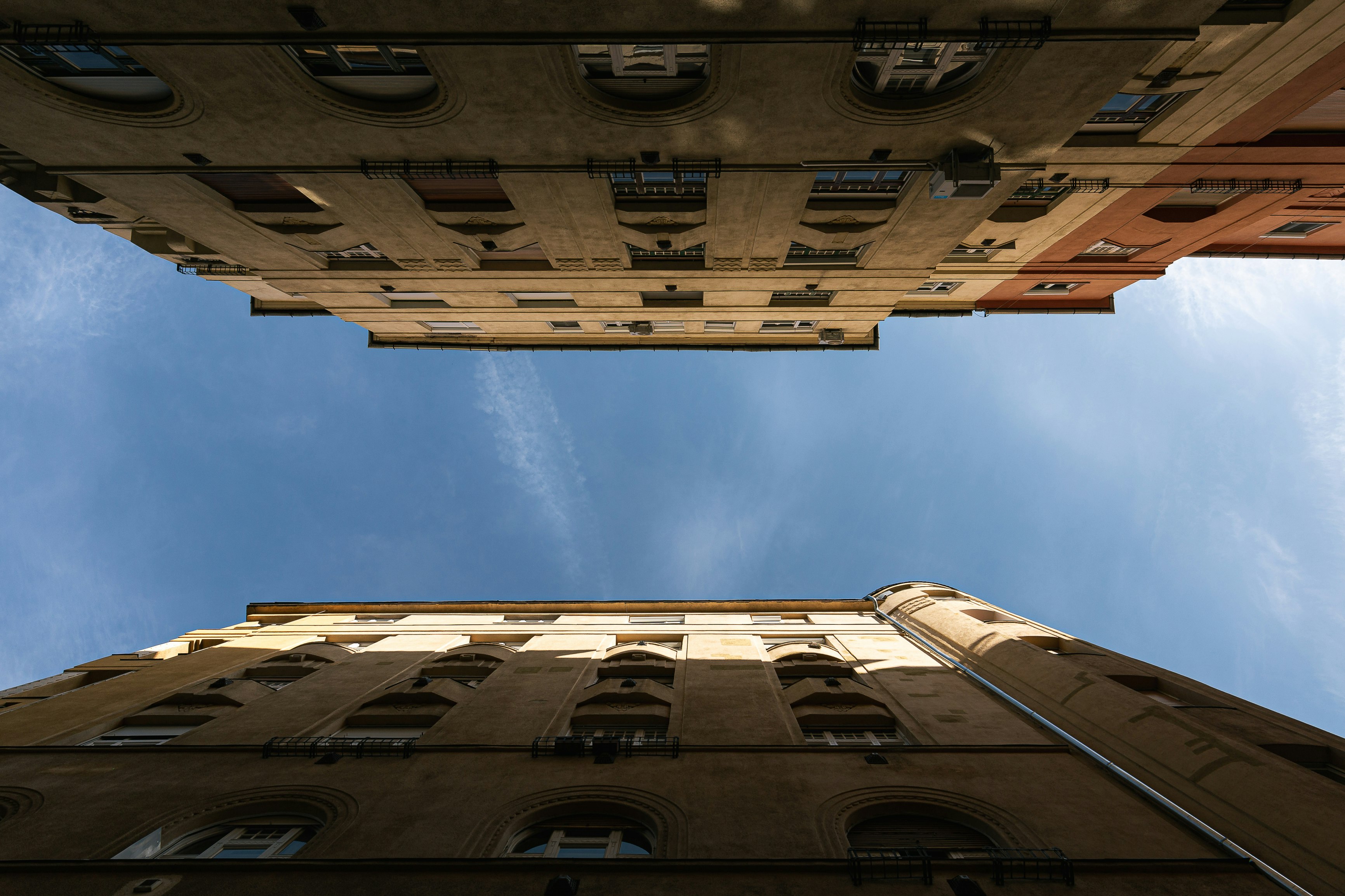 brown concrete building under blue sky during daytime