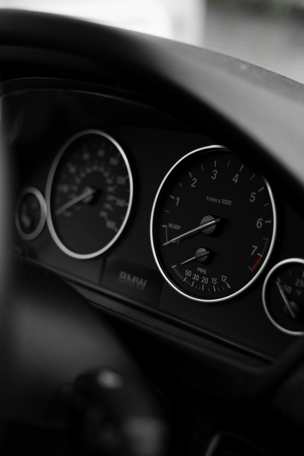 black and white analog instrument panel cluster