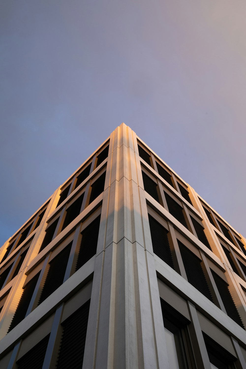 white concrete building under blue sky during daytime