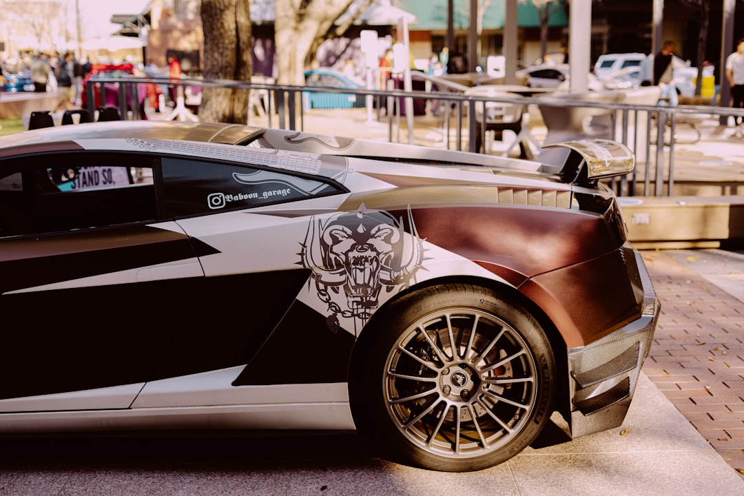 black lamborghini aventador parked on street during daytime