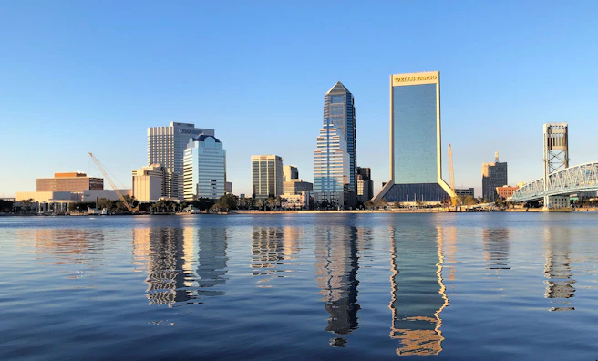 jacksonville, Florida skyline across body of water during daytime