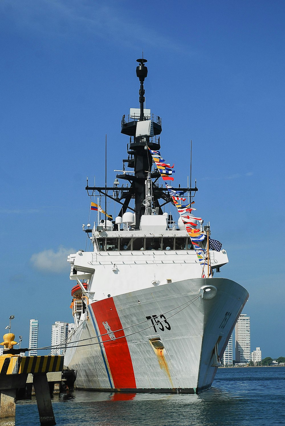 white and red ship on sea during daytime