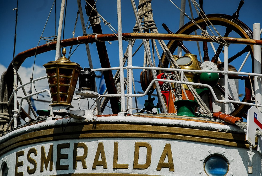 brown and white boat with green and brown metal frame