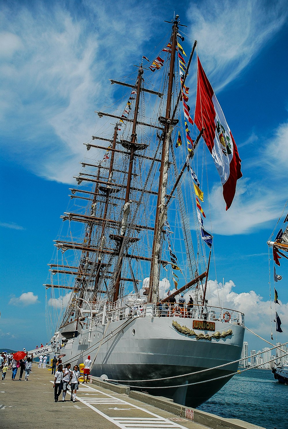 white sail boat on sea under blue sky during daytime