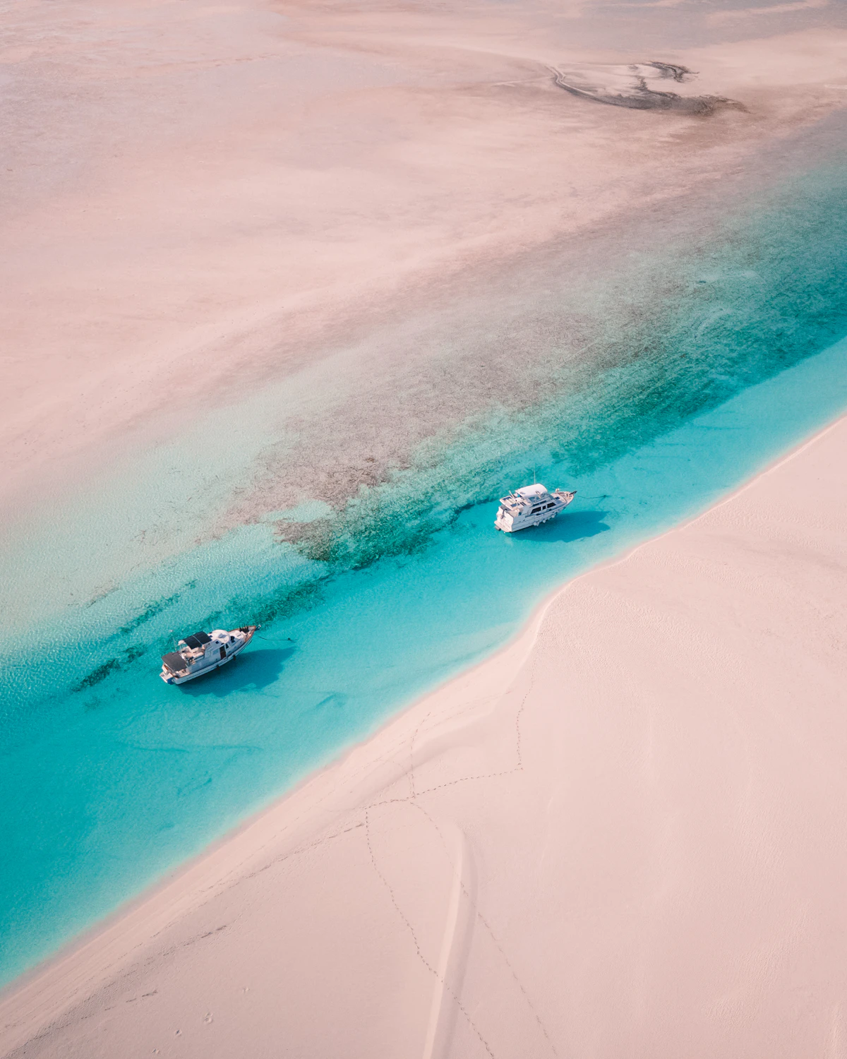 White sand and clear water from above