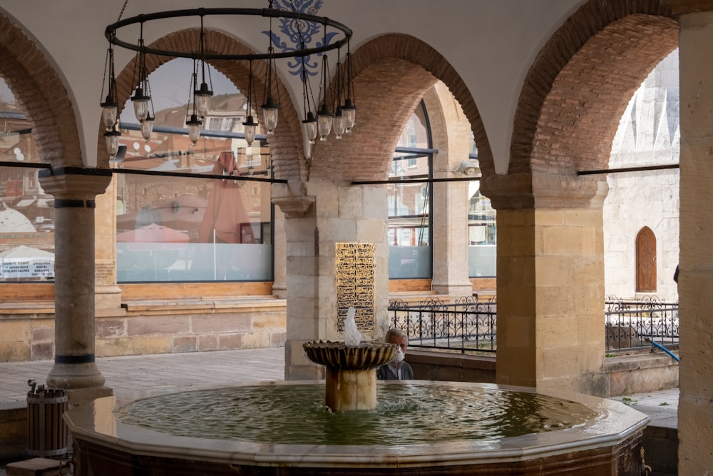 brown concrete building with water fountain